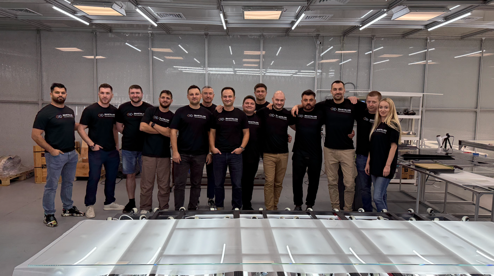 Founder Vasile Turcan in front of the Smart Lock Technologies and Smart Glass Technologies team
